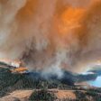 A smoke column rises from wildfire near Lodgepole Alberta Canada on May 4 2023 amd