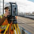 Surveyor monitoring infrastructure project using S9 total station and Trimble Access Monitoring field software 1